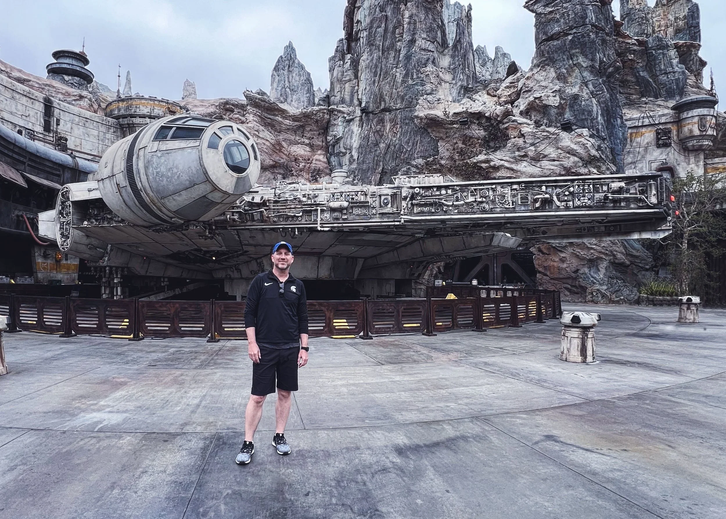 Chuck Eiler standing in front of a full size Millennium Falcon