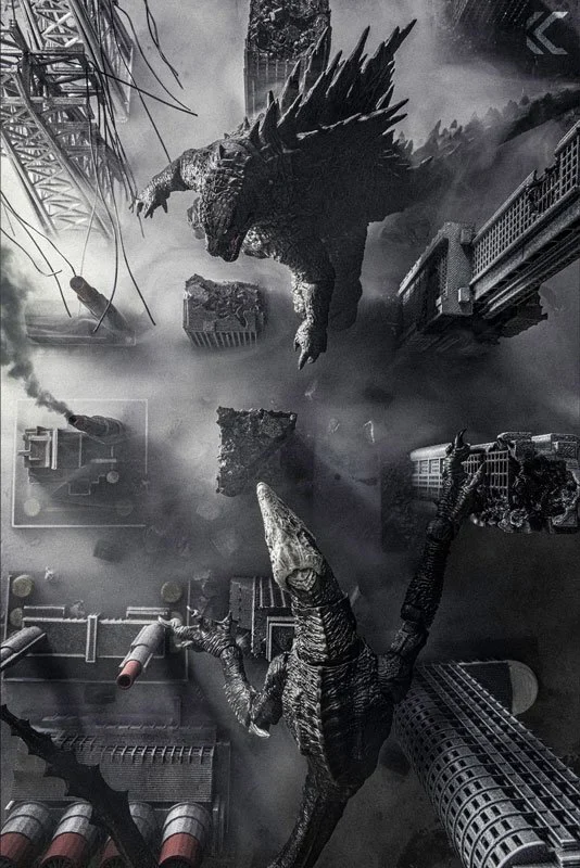 Black and white image of Godzilla and a winged kaiju destroying a city