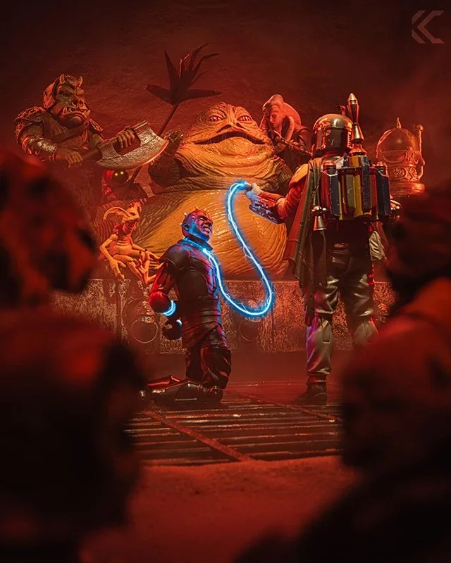 Jabba the Hutt's court lit in deep red, with Boba Fett and a glowing blue energy whip