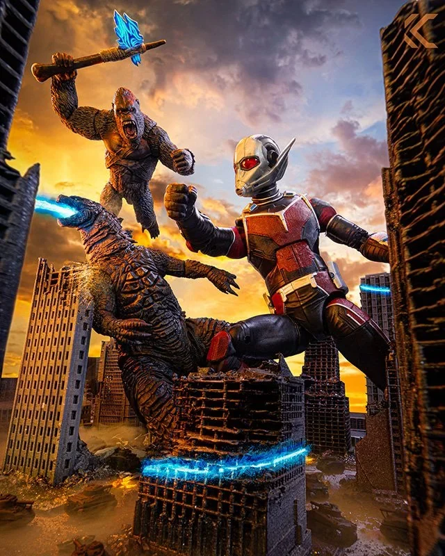 Ultraman and King Kong fighting a kaiju among toppled skyscrapers at sunset