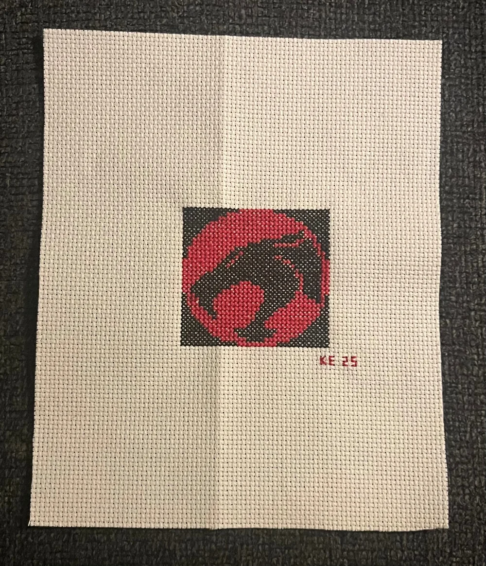 The ThunderCats insignia hand-stitched in cross-stitch, by Fireknight