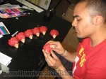 Mezco Sales Coordinator and Thundercats expert Pierre Kalenzaga checks quality of Lion-O heads.