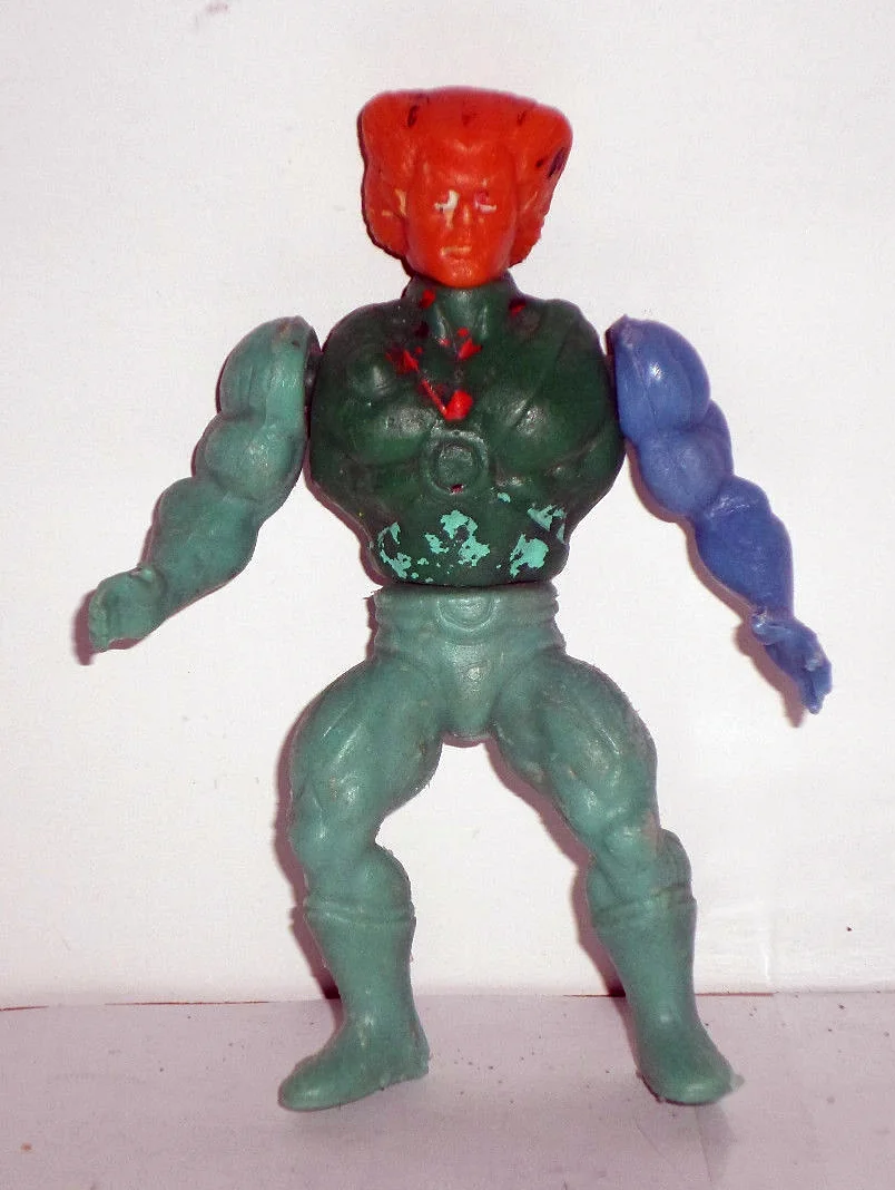 Tygra knock-off. Green body, wrong head, pink accents. A parts-bin figure.