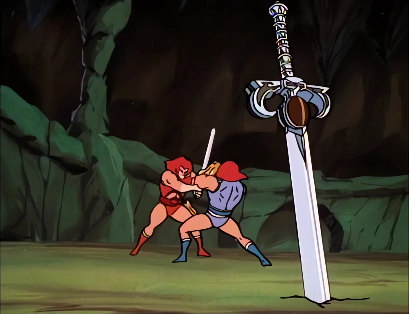 The two Lion-Os grapple beside the planted Sword of Omens in the cave