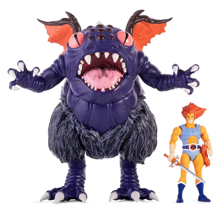 The Super7 ThunderCats ULTIMATES Vinyl Astral Moat Monster standing beside a seven-inch ULTIMATES Lion-O figure, which reaches roughly to the creature's hip
