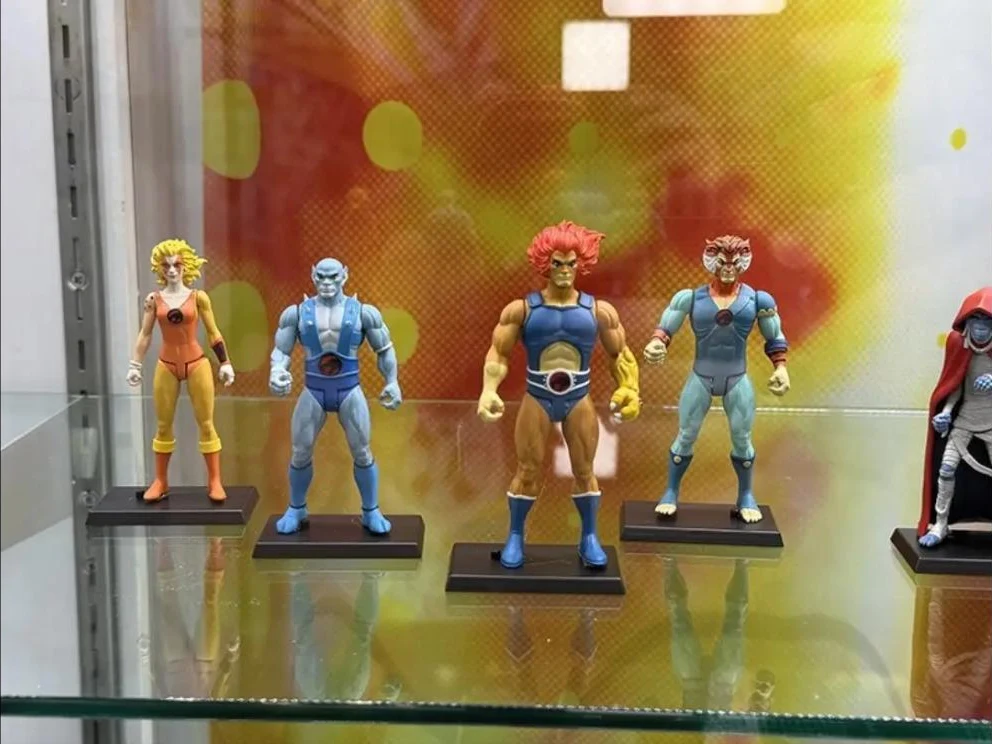 Mezco's 5 Points ThunderCats display at NYCC 2026 with Cheetara, Panthro, Lion-O and Tygra on black stands