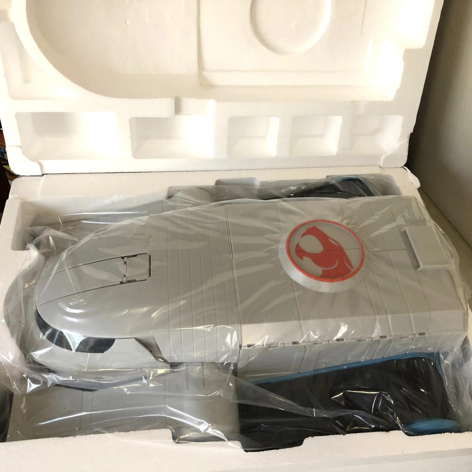 The Toy Color ThunderTank in its plastic sleeve inside the packaging
