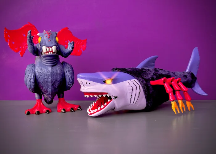 The custom Black Widow Shark posed beside a vintage LJN winged creature figure for scale