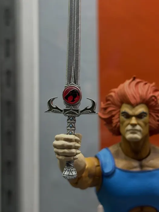 Detail of the Sword of Omens crossguard and Eye of Thundera on the Mezco One:12 Lion-O