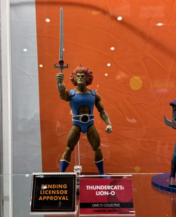 Mezco One:12 Collective Lion-O in the case at SDCC 2026 with the Pending Licensor Approval and Coming Soon placards